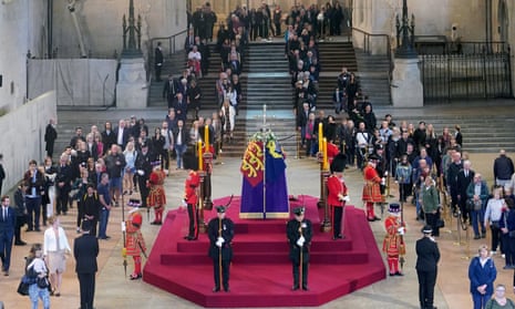 Members of the public filing past the coffin of Queen Elizabeth II, lying in state on the catafalque in Westminster Hall, at the Palace of Westminster.