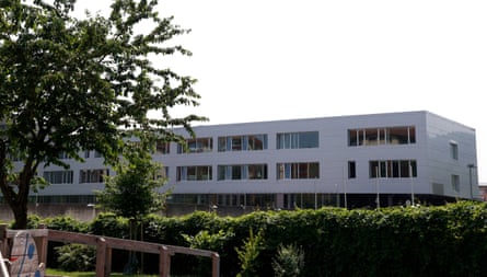 White, rectangular-shaped three-floor building