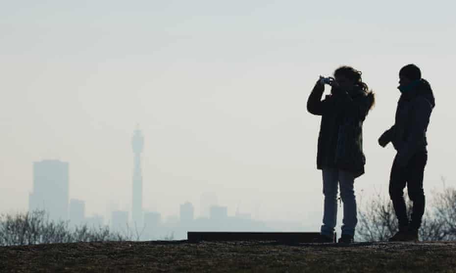 People look out from Parliament Hill towards central London during a ‘very high’ pollution alert in January.