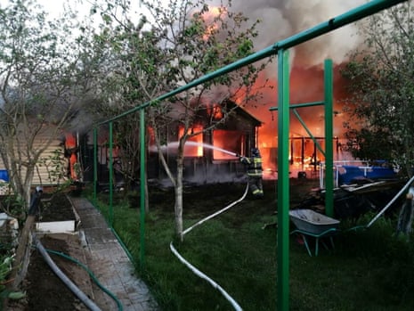 Moscow governor Andrei Vorobyov published this photograph on Telegram on Wednesday of a firefighter working outside a burning house in the Moscow region.