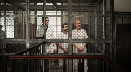 Julian Maroun, Rahel Romahn and Richard Roxburgh as Mohamed, Baher and Peter standing in court.