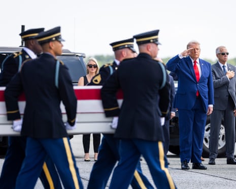 Donald Trump salutes as a carry team carries the remains of Staff Sergeant Michael Emmanuel Swinton, who was killed in Iraq during the controlled detonation of an Iranian drone, during a dignified transfer at Dover Air Force Base in Dover, Delaware on 22 July.