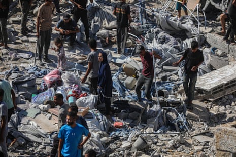 A view of the destruction caused after the Israeli army targeted a 7-story building known as the Al-Roya Tower with an airstrike in Gaza City.