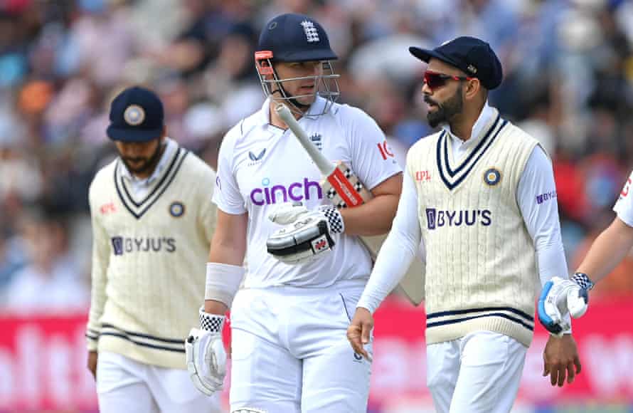 Alex Lees chats with Virat Kohli as they come off for tea.