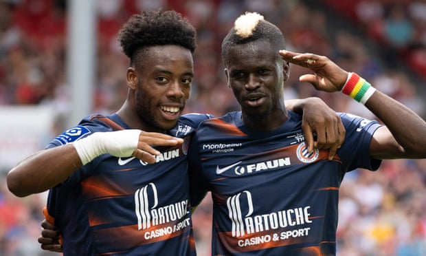 Elye Wahi (left) celebrates scoring his second and Montpellier's fifth goal with teammate Falaye Sacko.