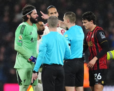 Liverpool's Alisson Becker, Mohamed Salah and Virgil van Dijk protest to referee Michael Salisbury after the final whistle.