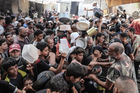 Hot meals were distributed at the Nuseirat refugee camp in central Gaza to Palestinians struggling to access food due to Israel's blockade of the Gaza Strip and the deepening hunger crisis.