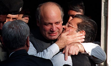 Nawaz Sharif embraces party colleague Sufdar Hussian Shah outside the supreme court in Karachi.