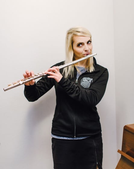 Elizabeth Swaney plays the flute at her family’s home in Oakland.