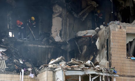 Rescuers work in a nine-storey residential building partially destroyed as a result of Russian missiles strike in Kryvyi Rih.