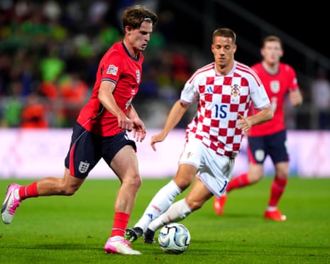 Alex Scott battles for the ball with Mario Pasalic during the Nations League match between England and Croatia.