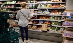 A customer shops for groceries at a supermarket.