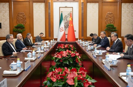 Araghchi and Wang sat with half a dozen other officials during a meeting.