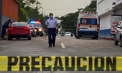 An ambulance remains outside the Playamed hospital, where a wounded person was transferred after the shooting in a hotel in Xcaret, Playa del Carmen, last week.