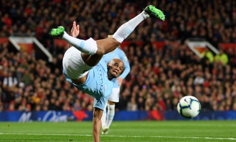 Vincent Kompany of Manchester City stretches for the ball in the air during the Premier League match between Manchester United and Manchester City at Old Trafford on April 24, 2019