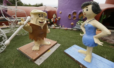 Figurines of Barney and Betty Rubble stand outside the house in Hillsborough, California.