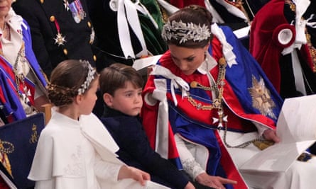 Kate, Princess of Wales, right, Princess Charlotte, left, and Prince Louis, centre, attending the coronation.