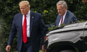 Donald Trump talks to chief of staff Mark Meadows as they leave the White House on Saturday.