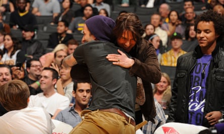 David Beckham and Tom Cruise greet each other at an NBA game in 2011