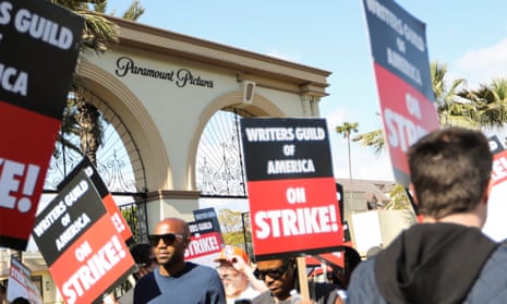 Workers and supporters of the Writers Guild of America protest at a picket line outside Paramount Studios after union negotiators called a strike for film and television writers in Los Angeles.