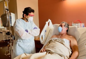 Ivan Melendez, left, the Hidalgo county health commissioner and a practising doctor, with a patient. ‘We’re the epicenter of the coronavirus in the United States.’