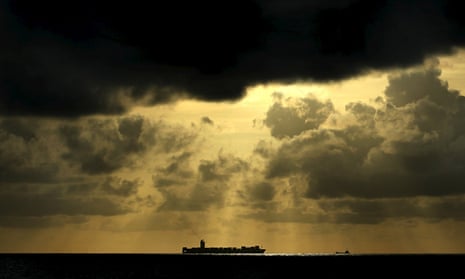 A container ship sails towards Colombo harbour, which would be redeveloped under the controversial Chinese plan.