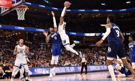 Ja Morant dunks for the Memphis Grizzlies during a game against the Minnesota Timberwolves