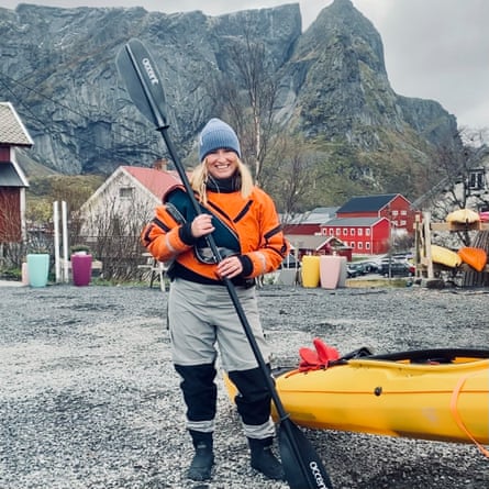 Blond woman with kayak and paddle