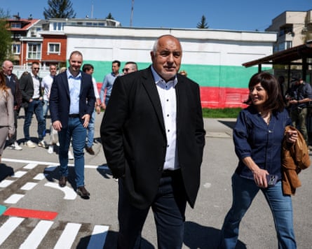 Boyko Borissov in conversation walking away from a polling station