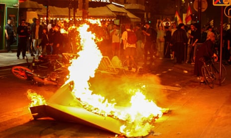 A barricade burns at the Place de la Republique.