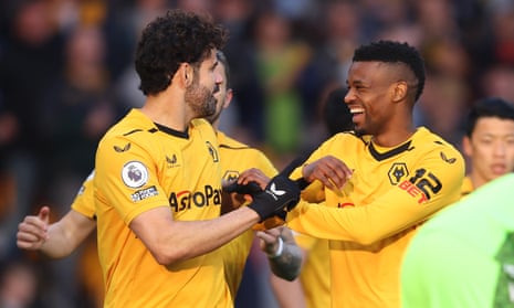 Diego Costa and Nelson Semedo of Wolverhampton Wanderers celebrate after Joachim Andersen of Crystal Palace (not pictured) scored an own-goal.