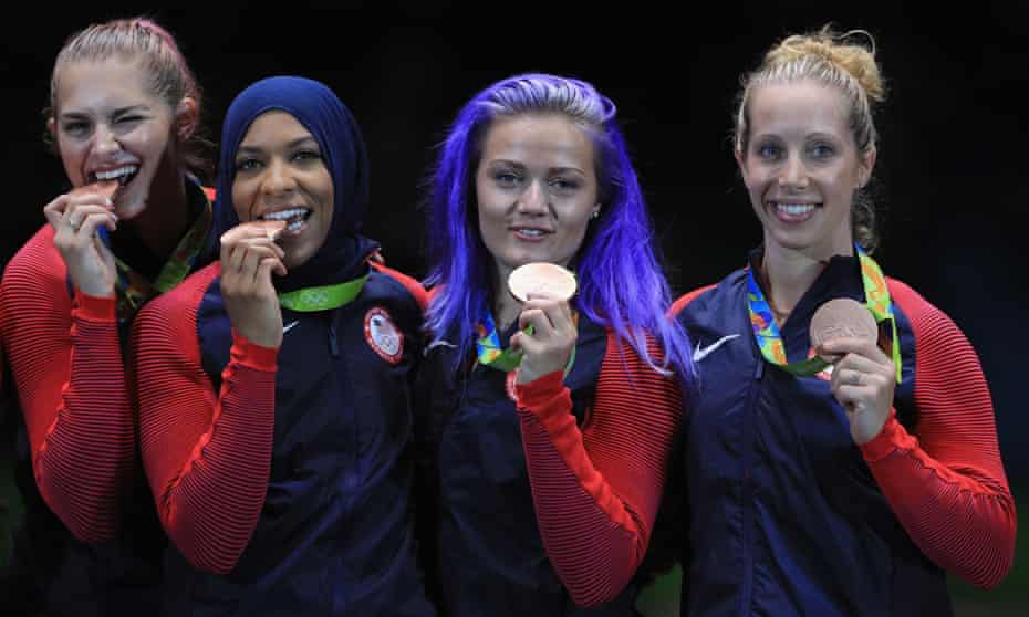 Bronze medalists Monica Aksamit, Ibtihaj Muhammad, Dagmara Wozniak and Mariel Zagunis celebrate their bronze medal.