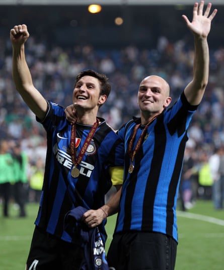 Javier Zanetti and Esteban Cambiasso, wearing Giacinto Facchetti’s old shirt, celebrate at the end of the Champions League final.