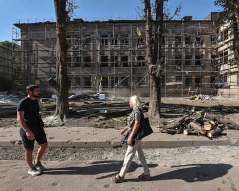 People walk at the compound of a hospital which was hit by a Russian missile strike, amid Russia's attack on Ukraine, in the city of Kamianske, Dnipro region.