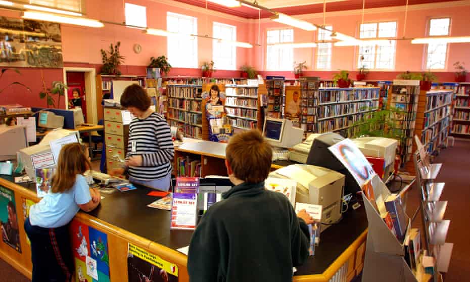 Children at the information desk in a Stockport library.