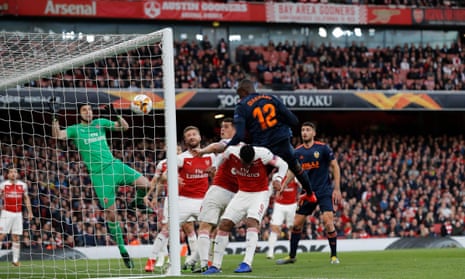 Shkodran Mustafi (centre) is one of three Arsenal players failing to react as Mouctar Diakhaby heads Valencia into an lead.
