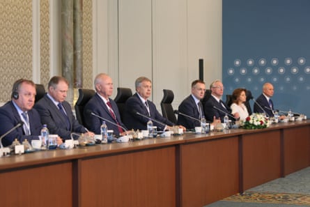 The Russian negotiating team sit behind a desk in Istanbul’s Çırağan Palace.