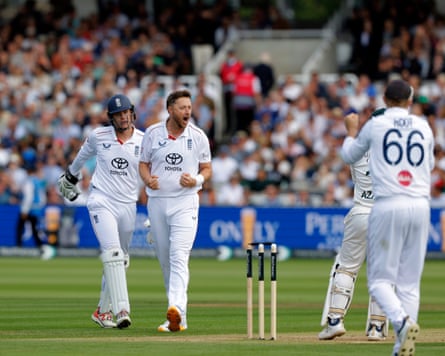 Ollie Robinson clenching his fists on the cricket grounds.