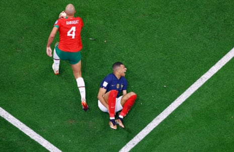 Kylian Mbappe goes down under a challenge from Sofyan Amrabat.