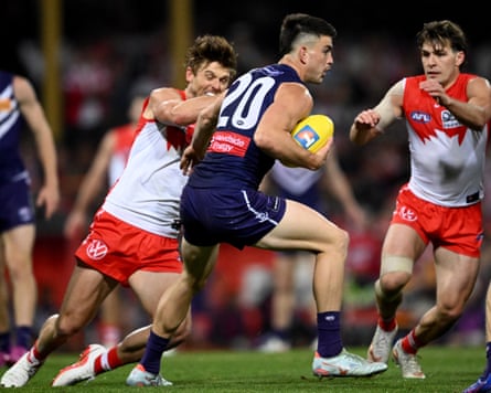 Patrick Voss shrugs a Dane Rampe tackle