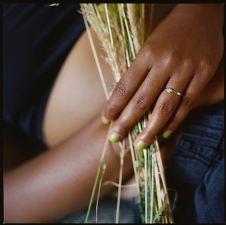 Poppy Noor’s hands holding dry grass