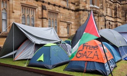 Protest in support of Palestinians in SydneyA Palestinian flag flutters next to the protest encampment in support of Palestinians in Gaza at The University of Sydney, amid the ongoing conflict between Israel and the Palestinian Islamist group Hamas, in Sydney, Australia May 3, 2024. REUTERS/Alasdair Pal
