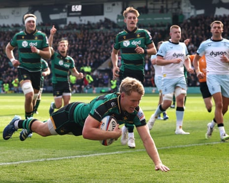 Fin Smith dives over the Bath line to start the Saints rolling
