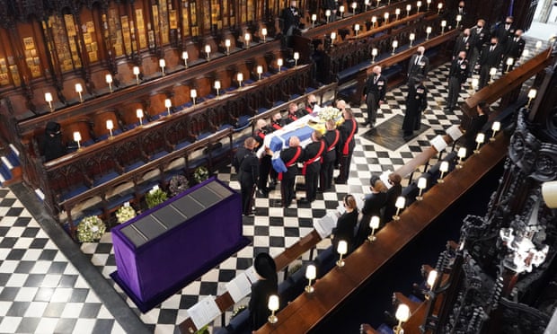 Queen Elizabeth watching as pallbearers carry the coffin of the Duke of Edinburgh during his funeral at St George’s Chapel in Windsor Castle.