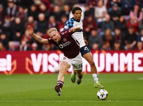 Harry Milne is ‘challenged’ by Falkirk's Kyrell Wilson.