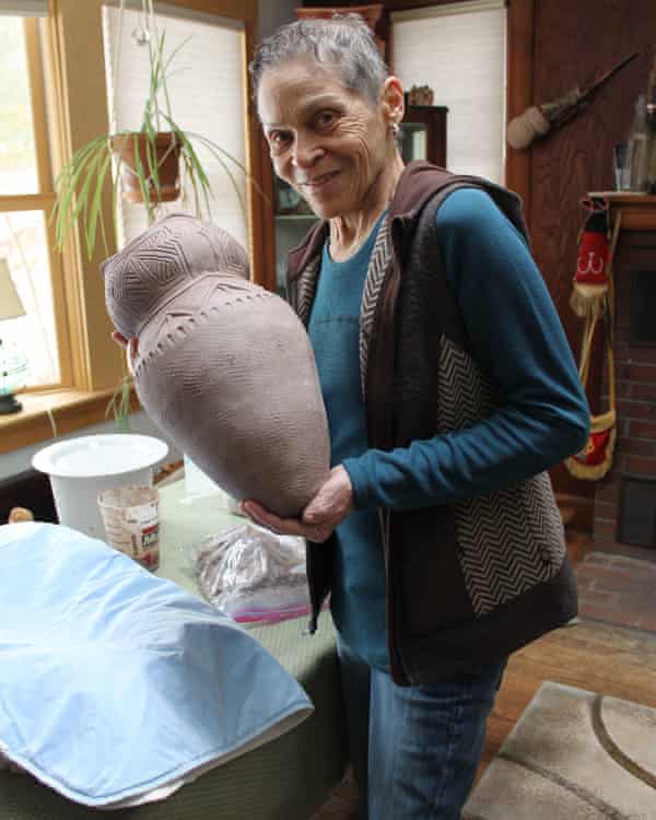 Wampanoag artist Ramona Peters with her ceramic cooking pot, on display at Mayflower 400: Legend &amp; Legacy exhibition.