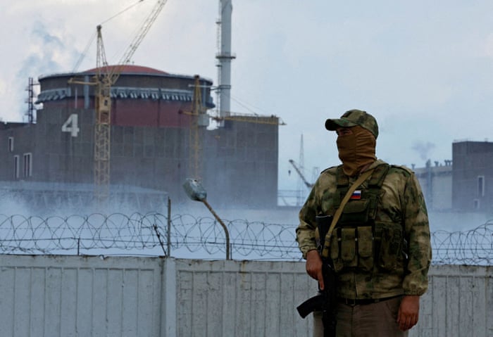 A Russian serviceman stands guard near the Zaporizhzhia nuclear power plant in Ukraine.