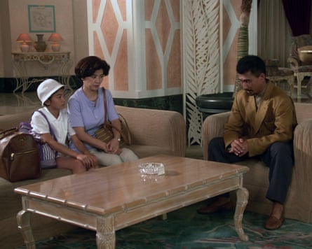 Renko and her parents sit uncomfortably