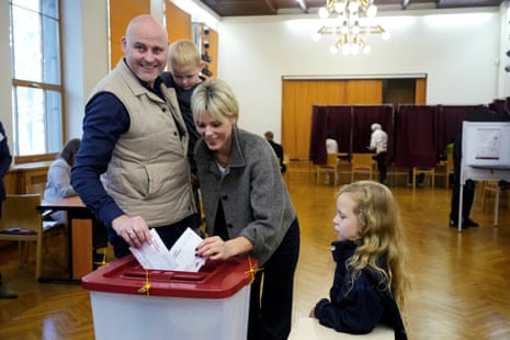 Latvian Prime Minister Andris Kulbergs and his wife Anna cast their votes during the general election in Riga, Latvia, October 3, 2026. REUTERS/Ints Kalnins/File Photo