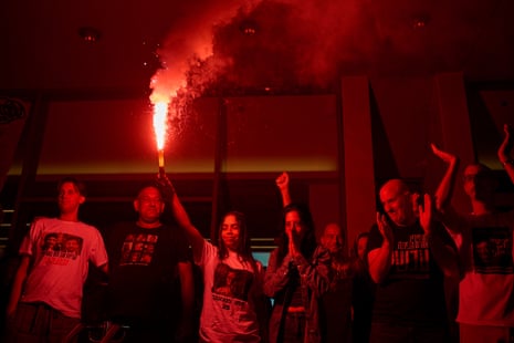 Einav Zangauker, centre, mother of Matan Zangauker, who is being held hostage by Hamas, celebrates along with other families and supporters of Israeli hostages as they gather at Hostages Square in Tel Aviv.